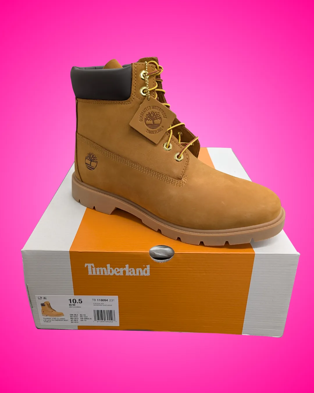 Timberland Classic lace-up boot in wheat nubuck with a padded dark brown collar and a lug sole, sitting on its white and orange Timberland box